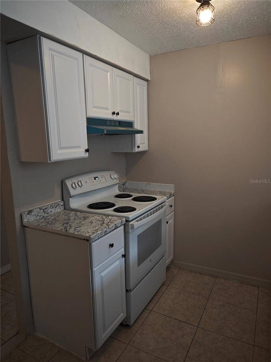 Side B all newly updated kithchen cabinets and refrigerator