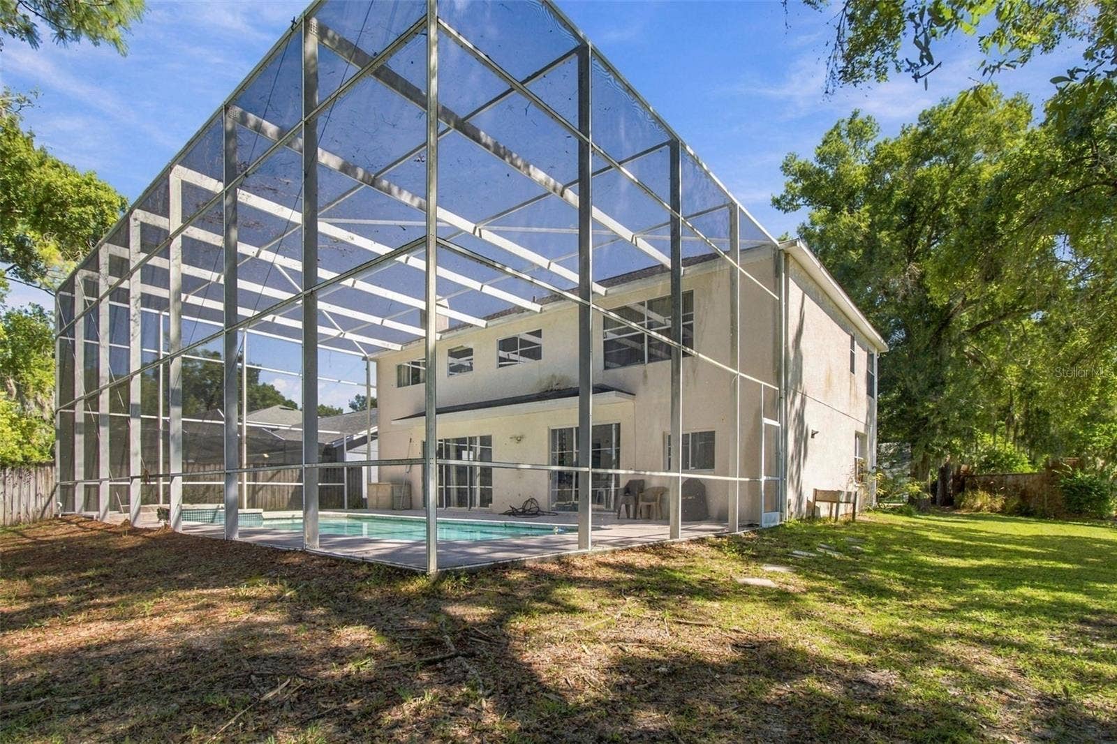 8102 STONEFIELD, Tampa, FL 33635 Screened in Patio Encompasses the house and pool