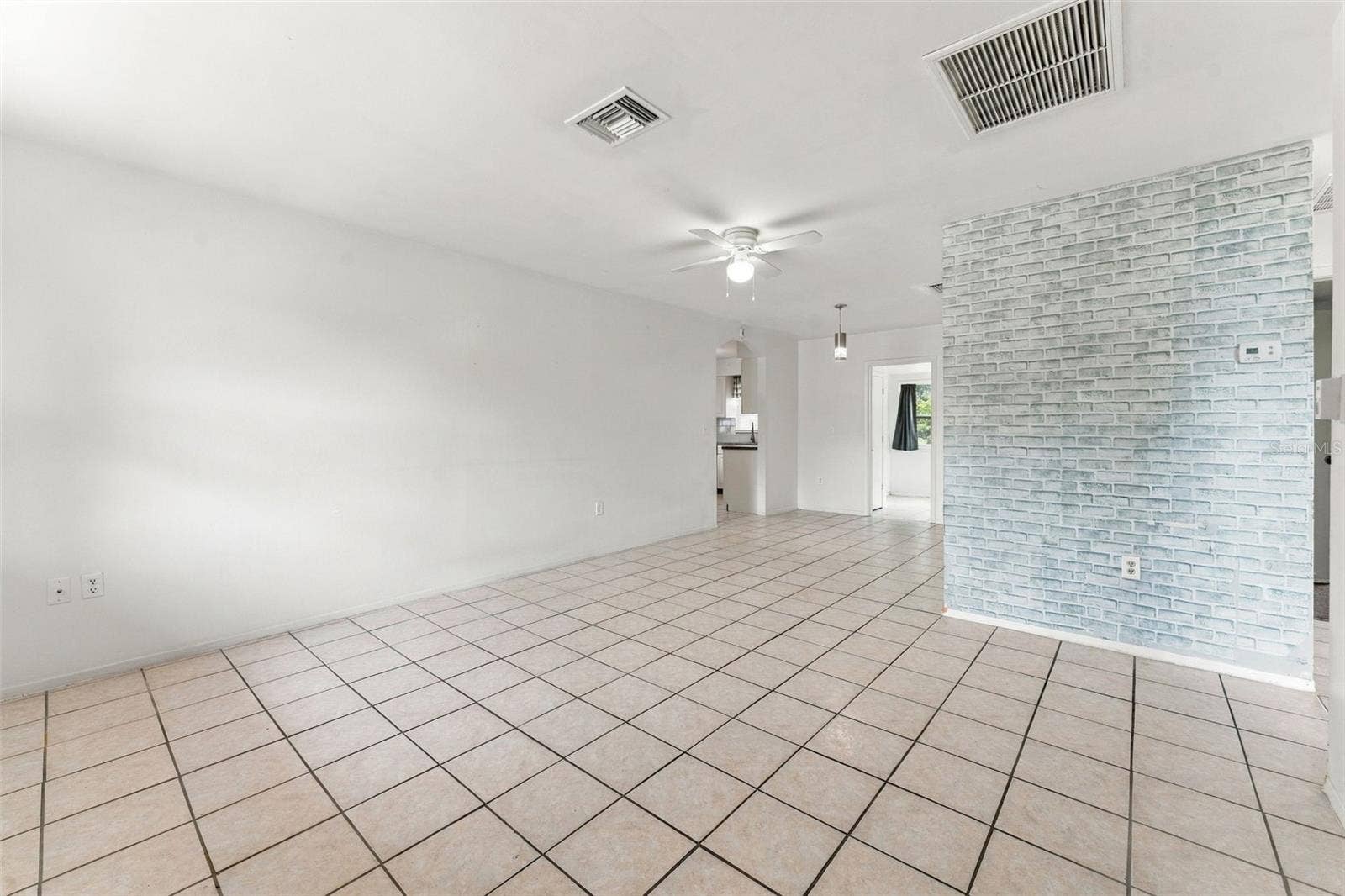 7303 RIVERBANK DRIVE, New Port Richey, FL 34655 Light-Filled Living Room