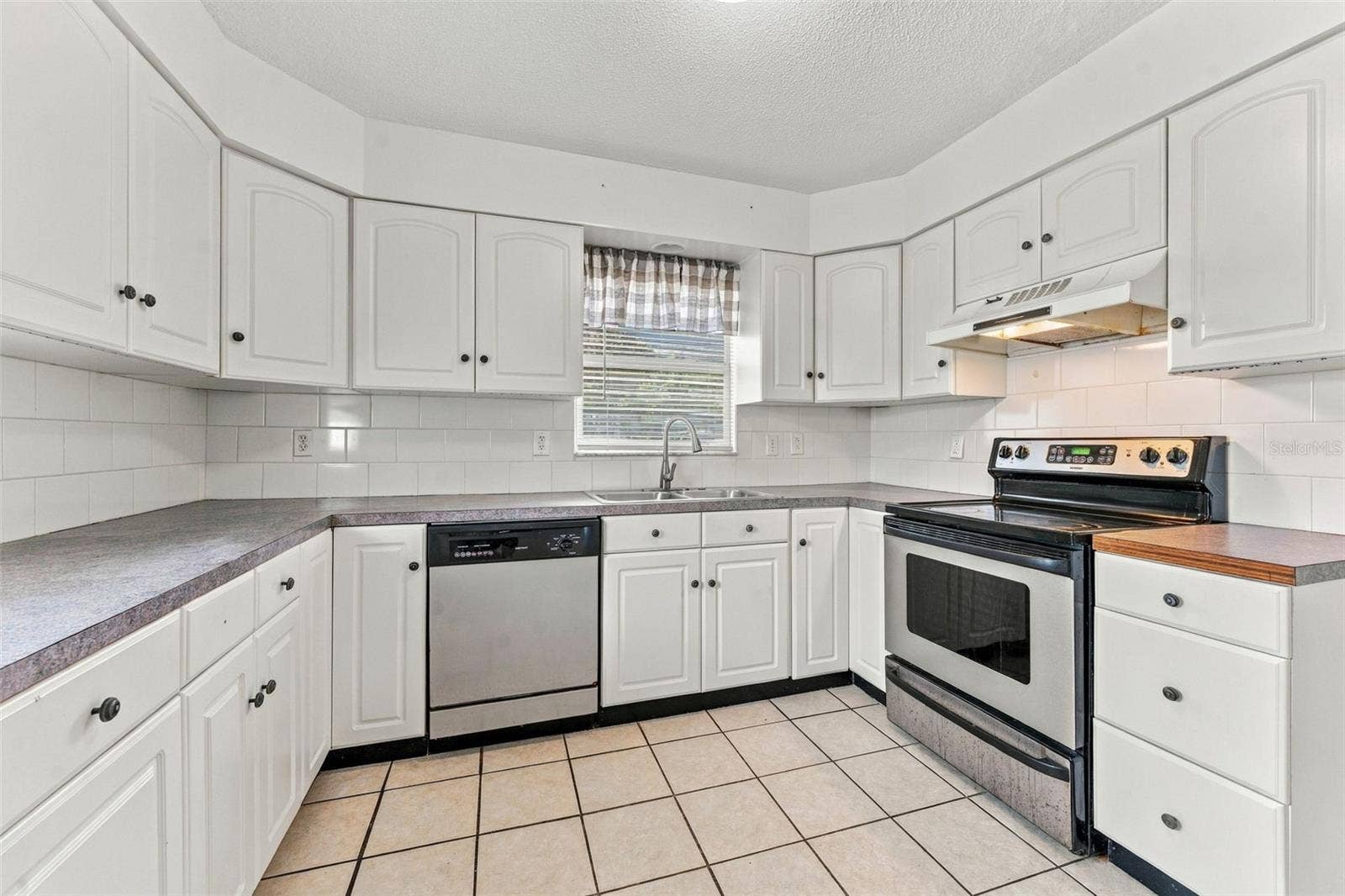 7303 RIVERBANK DRIVE, New Port Richey, FL 34655 Kitchen with Ample Cabinet Space