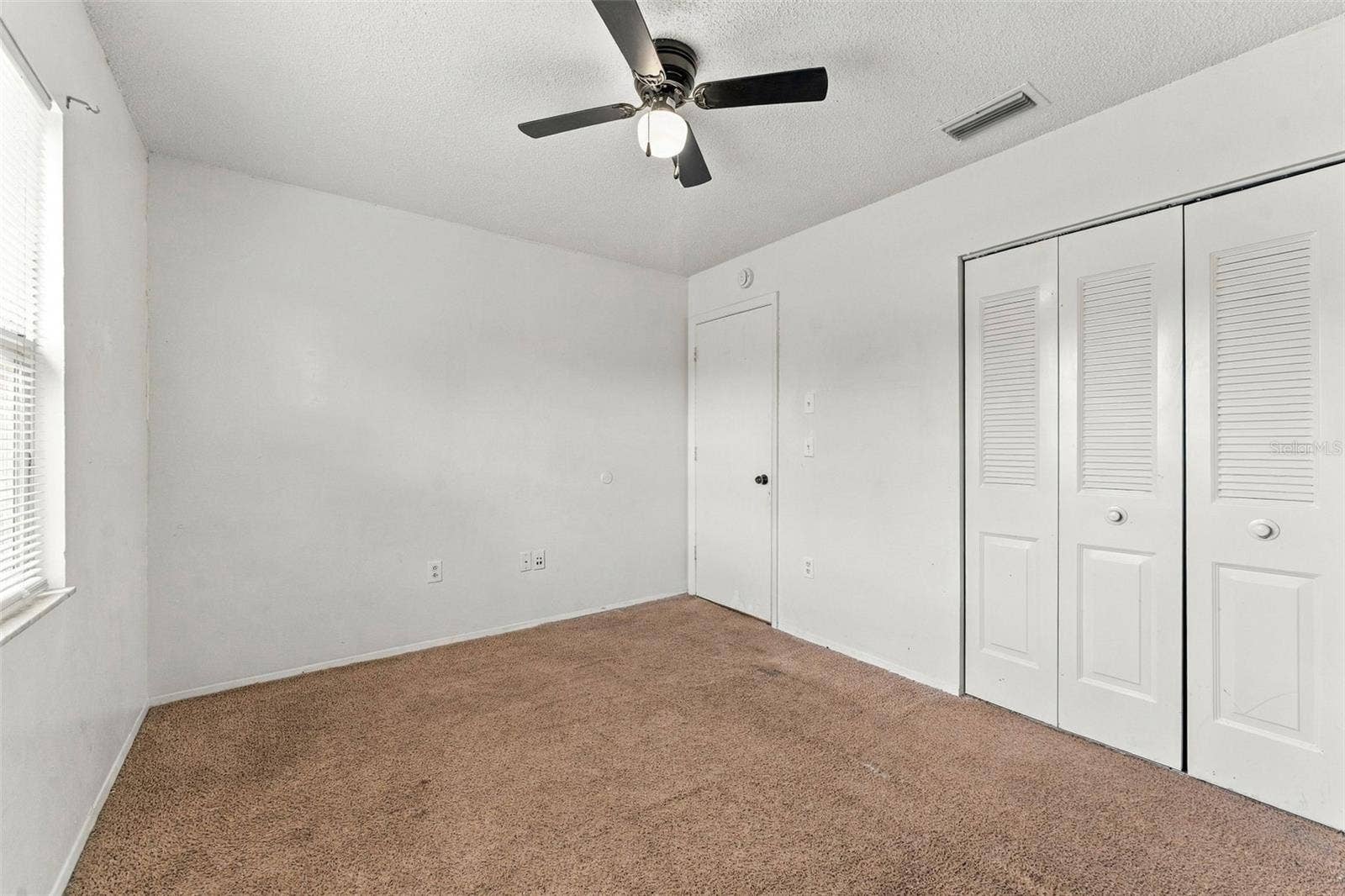 7303 RIVERBANK DRIVE, New Port Richey, FL 34655 Bedroom 2 with Built-in Closet