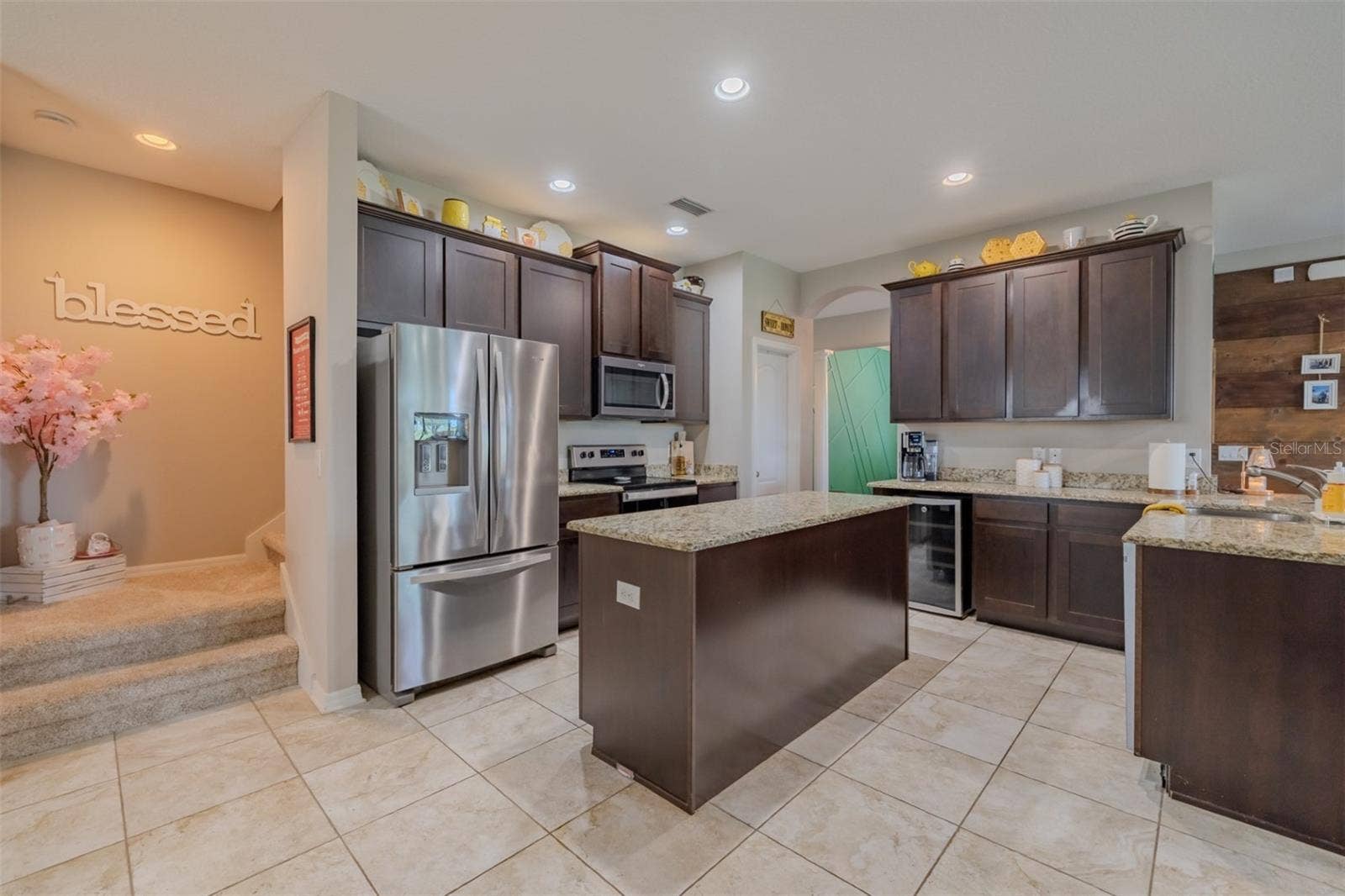9123 RAES CREEK PLACE, Palmetto, FL 34221 Kitchen with stairway to bonus room