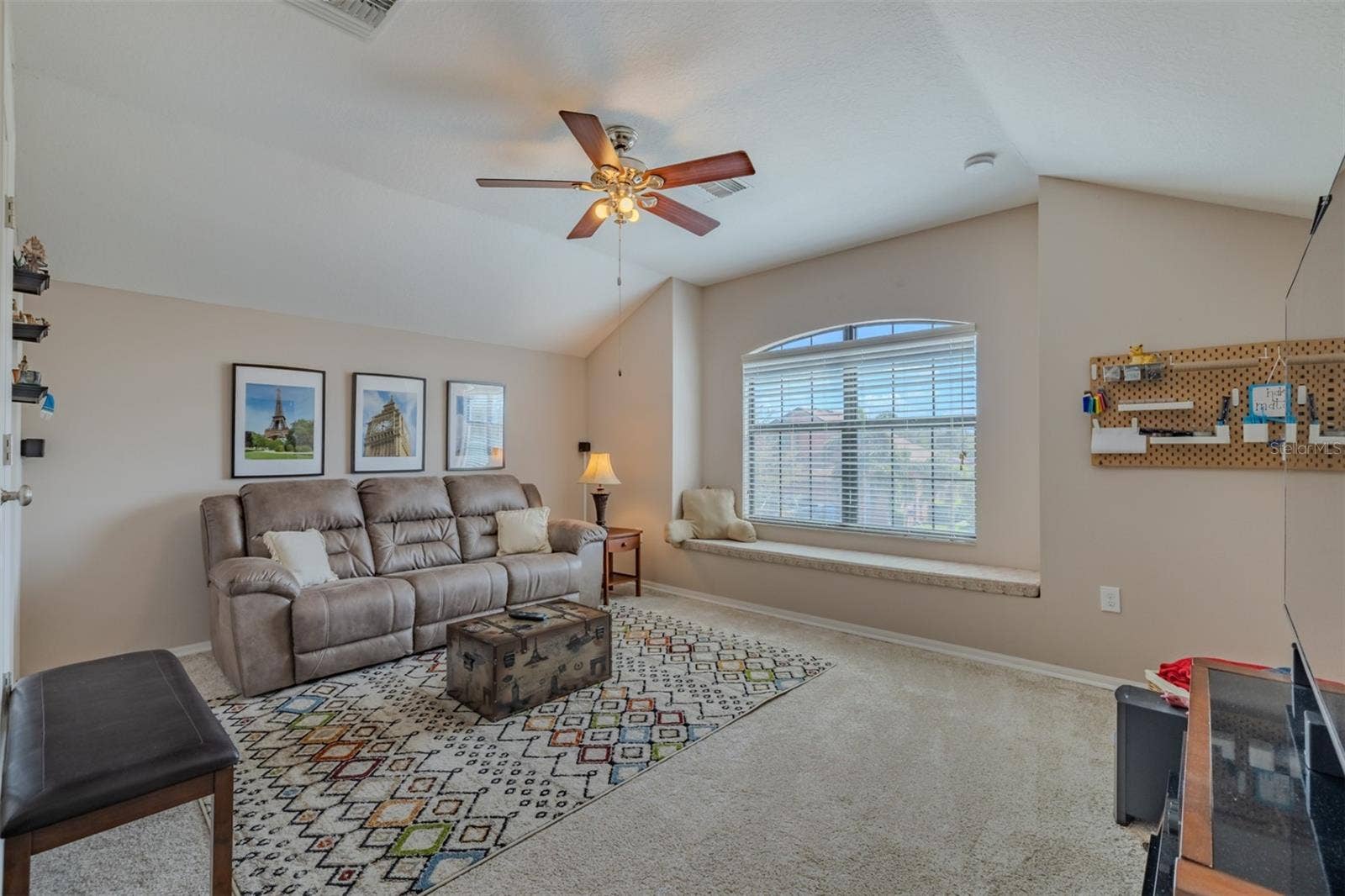 9123 RAES CREEK PLACE, Palmetto, FL 34221 Awesome bonus room with lovely window seat.Bonus room sofa and TV stand convey.