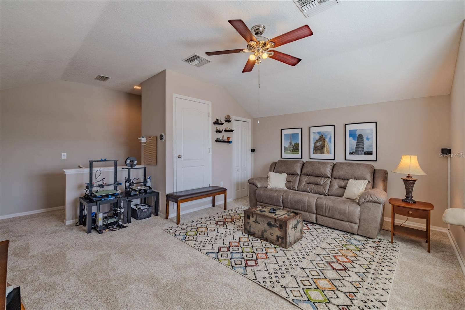 9123 RAES CREEK PLACE, Palmetto, FL 34221 Awesome bonus room with lovely window seat. Bonus room sofa and TV stand convey.