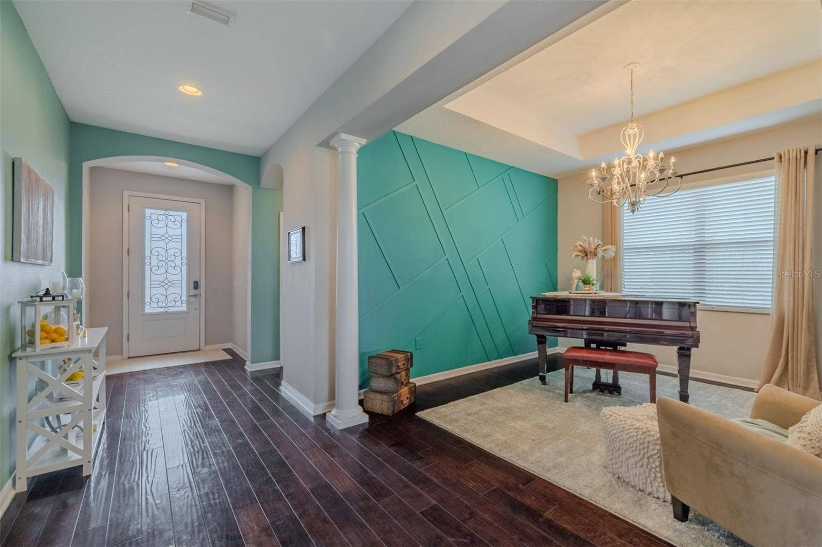 9123 RAES CREEK PLACE, Palmetto, FL 34221 Entry way with formal dining room used as piano room