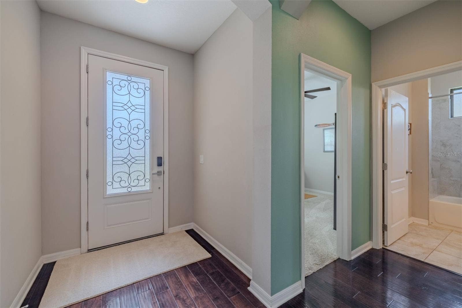 9123 RAES CREEK PLACE, Palmetto, FL 34221 Entry way with bedroom 4 & adjacent full bath