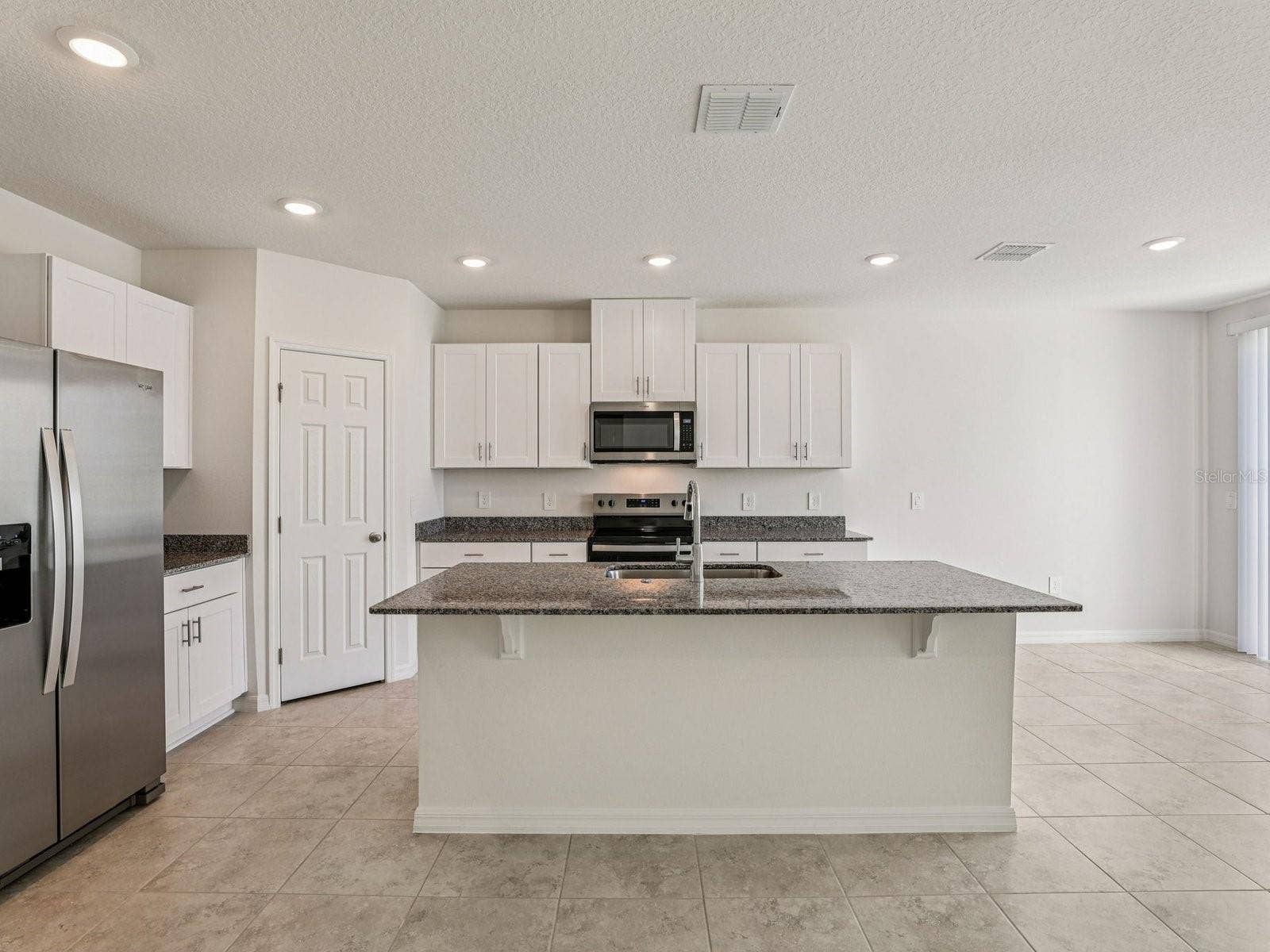 12580 HOMELAND DRIVE, Dade City, FL 33525 Photo is not of the actual home, but is an inspirational photo of builders model home and may depict options, furnishings, and/or decorator features that are not included