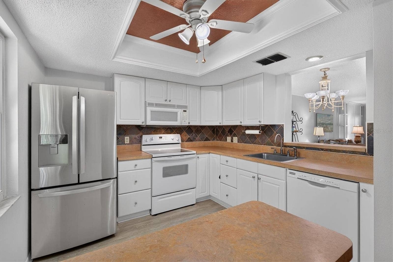 Newer appliances and wood cabinets