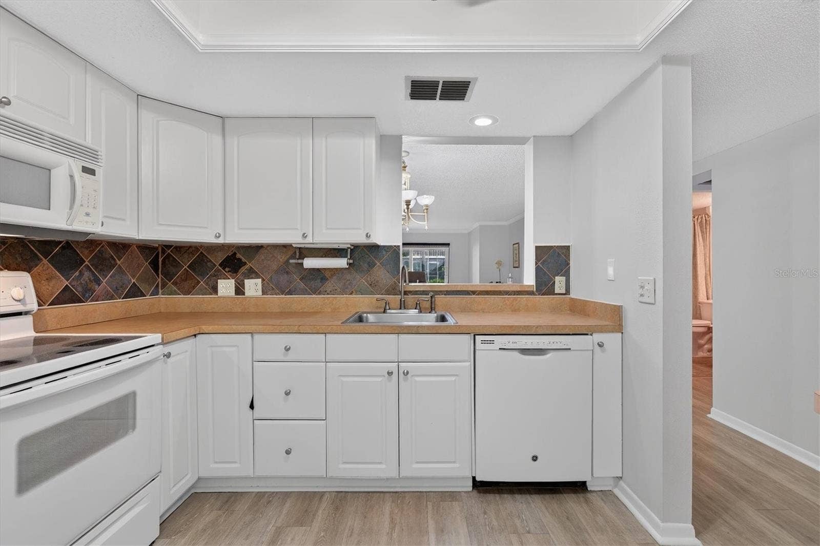 Kitchen opens to living area