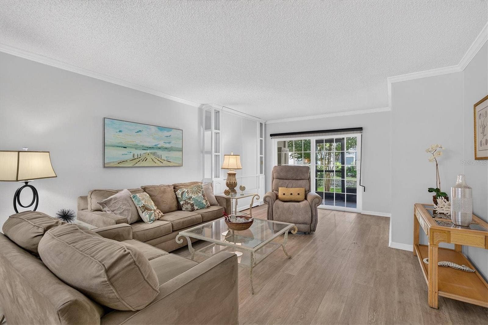 Fresh paint, crown molding and wood look flooring