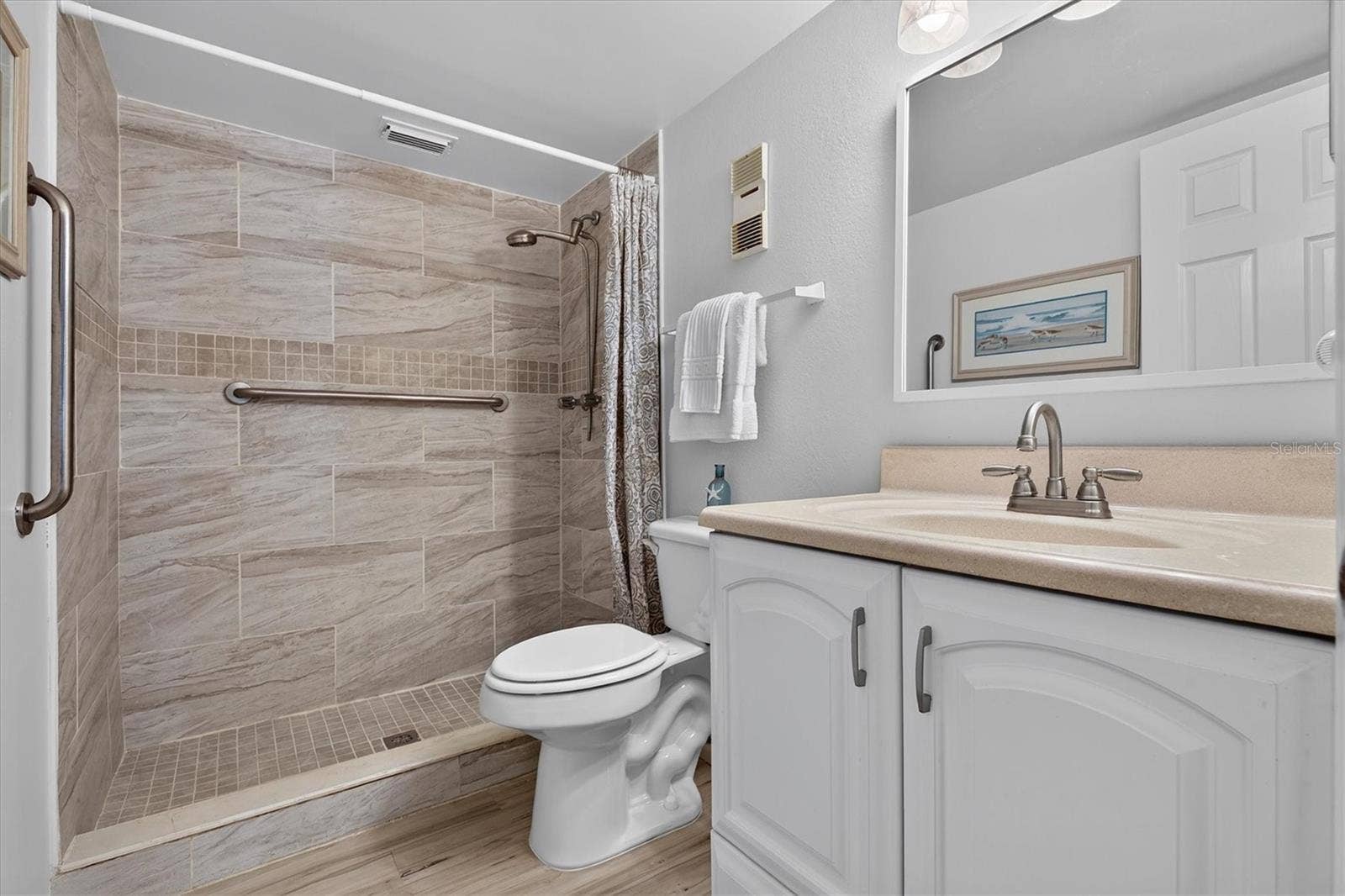 Updated primary bath with tile shower.