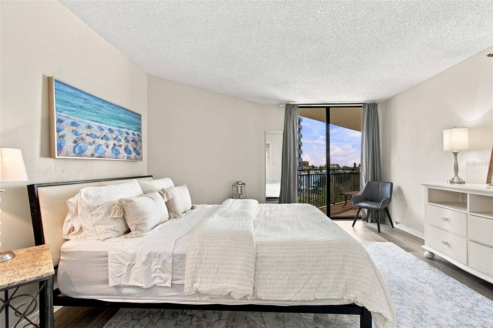 Primary suite with a view and access to balcony