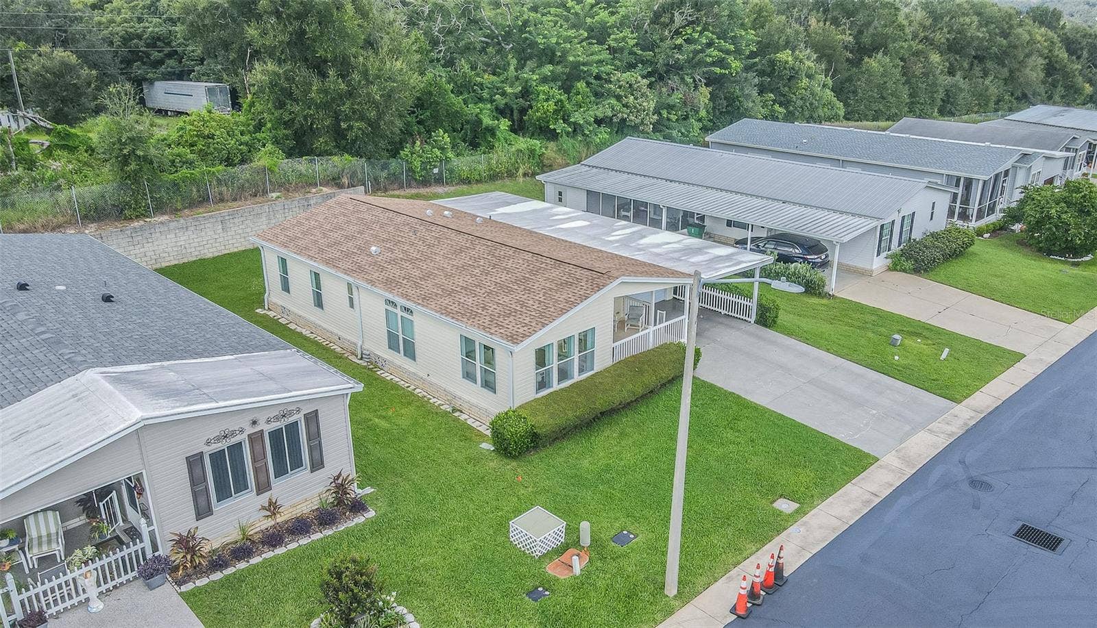 37232 NEUKOM AVENUE, Zephyrhills, FL 33541 Newer roof, lush lawn, landscaped front and private backyard