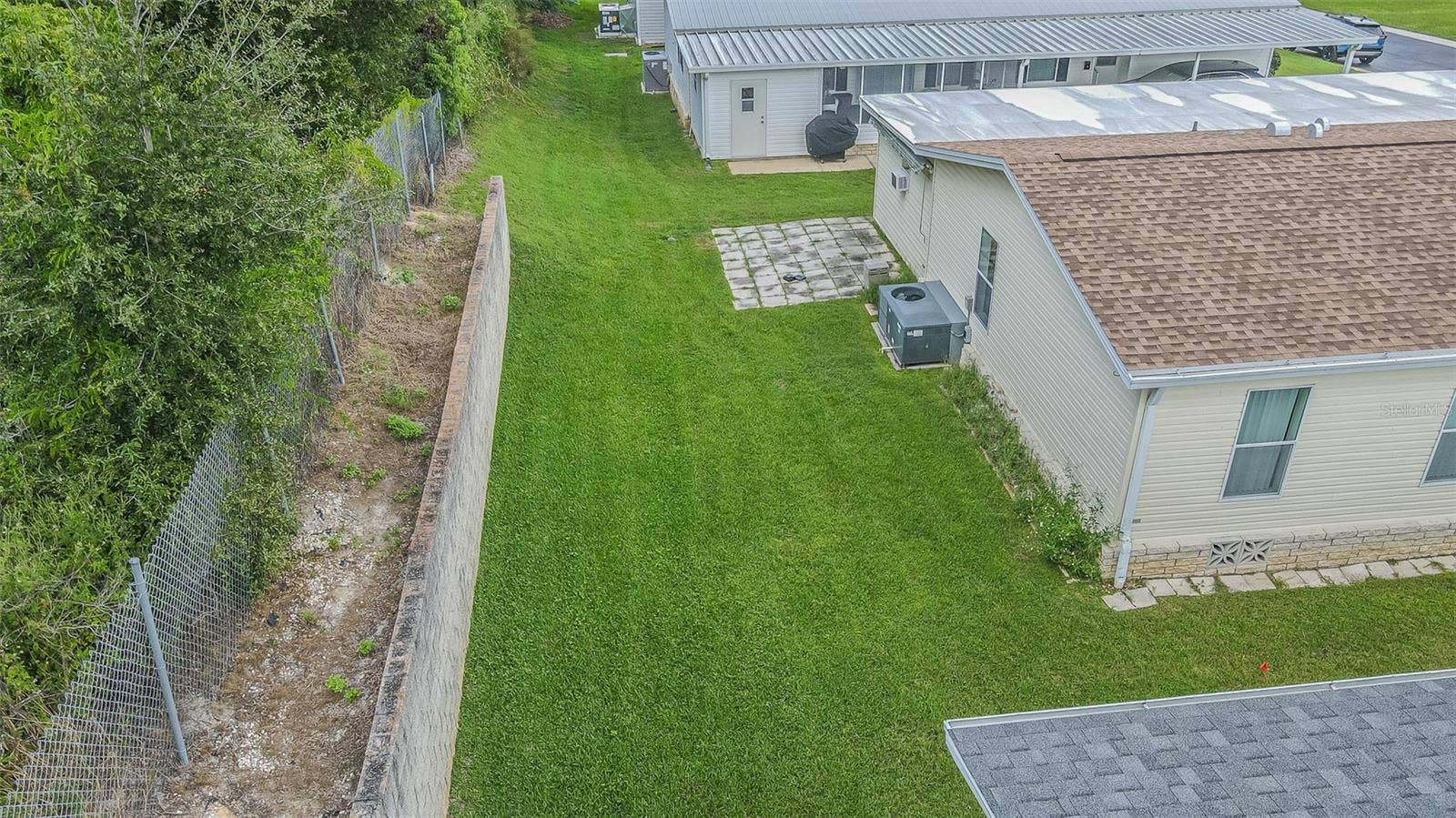 37232 NEUKOM AVENUE, Zephyrhills, FL 33541 Lush backyard with planting area