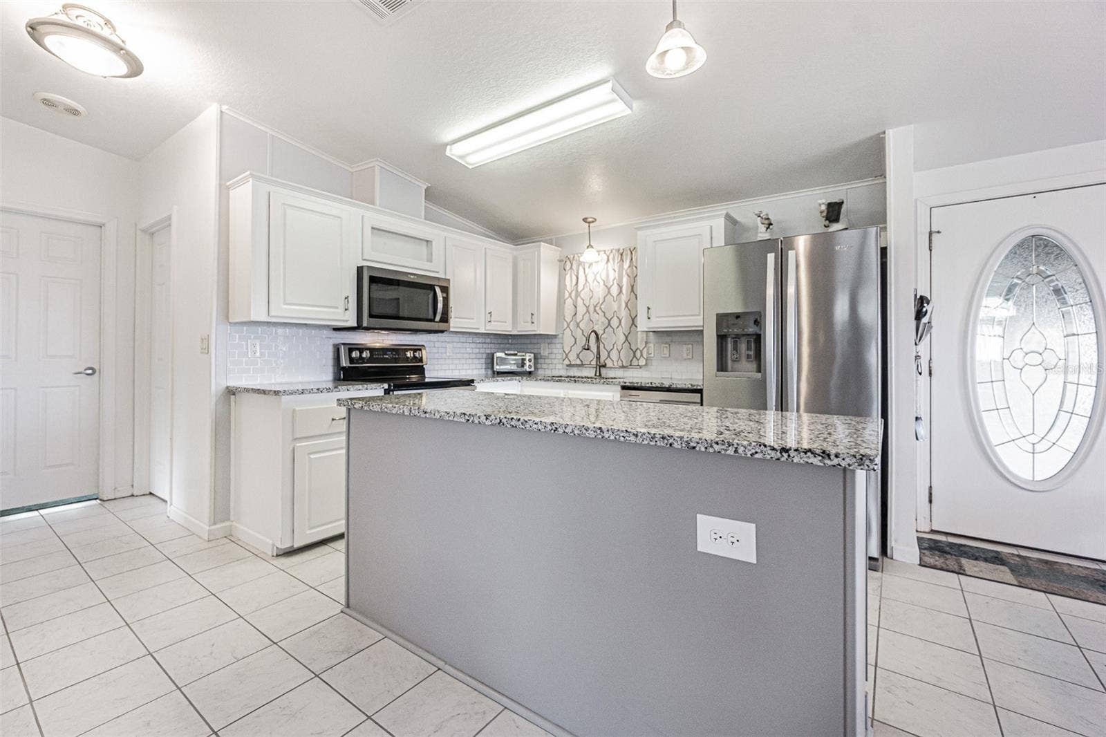 37232 NEUKOM AVENUE, Zephyrhills, FL 33541 Spacious kitchen with center island