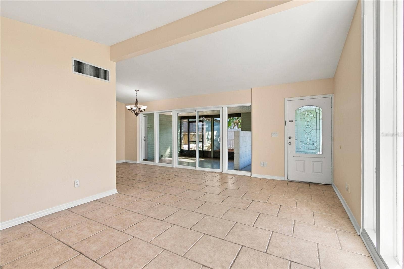 10312 LAKE CARROLL WAY, Tampa, FL 33618 Living room overlooking entry and new sliding doors.