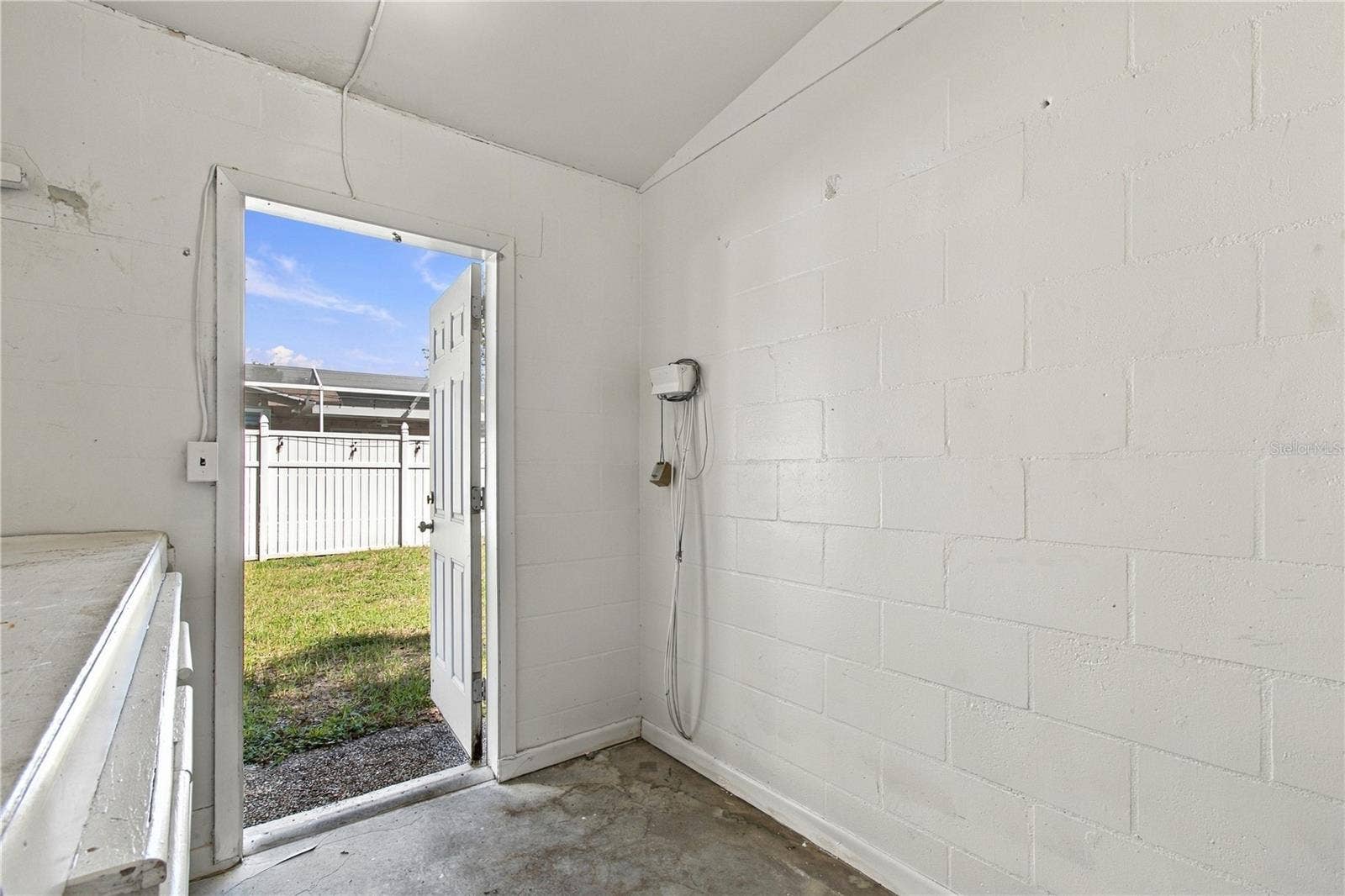 10312 LAKE CARROLL WAY, Tampa, FL 33618 Storage room attached to home located in rear