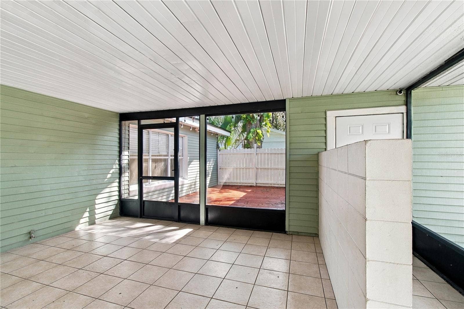 10312 LAKE CARROLL WAY, Tampa, FL 33618 Patio overlooking deck and garage access on right side