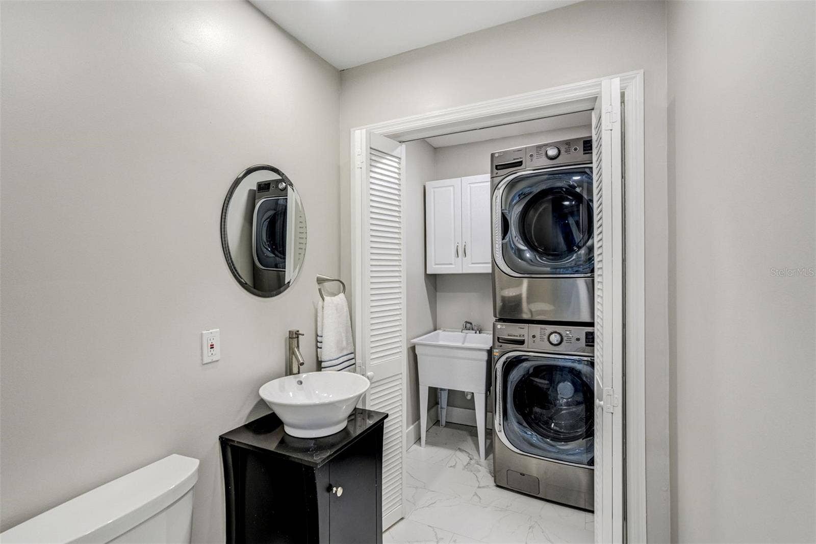 Laundry room with half bath