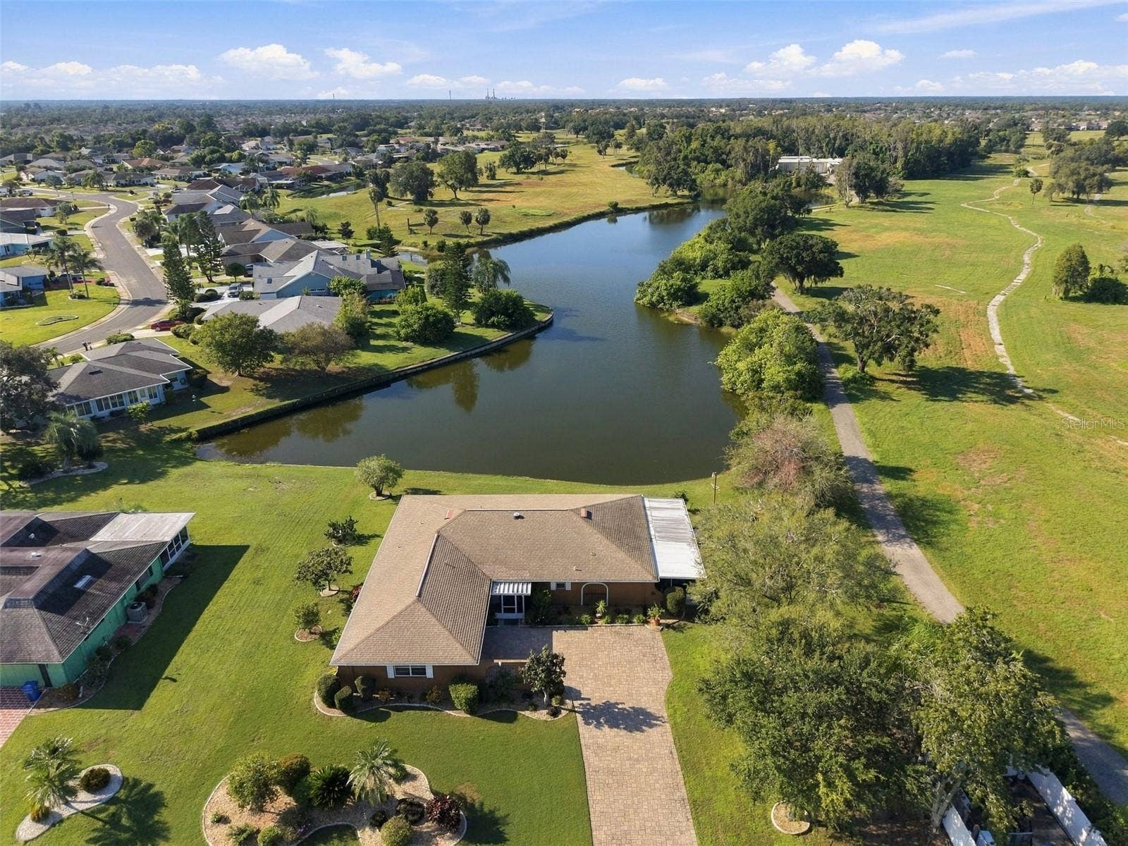 211 STONEHAM DRIVE, Sun City Center, FL 33573 Stunning water frontage, wild life and privacy is all here for you to enjoy.