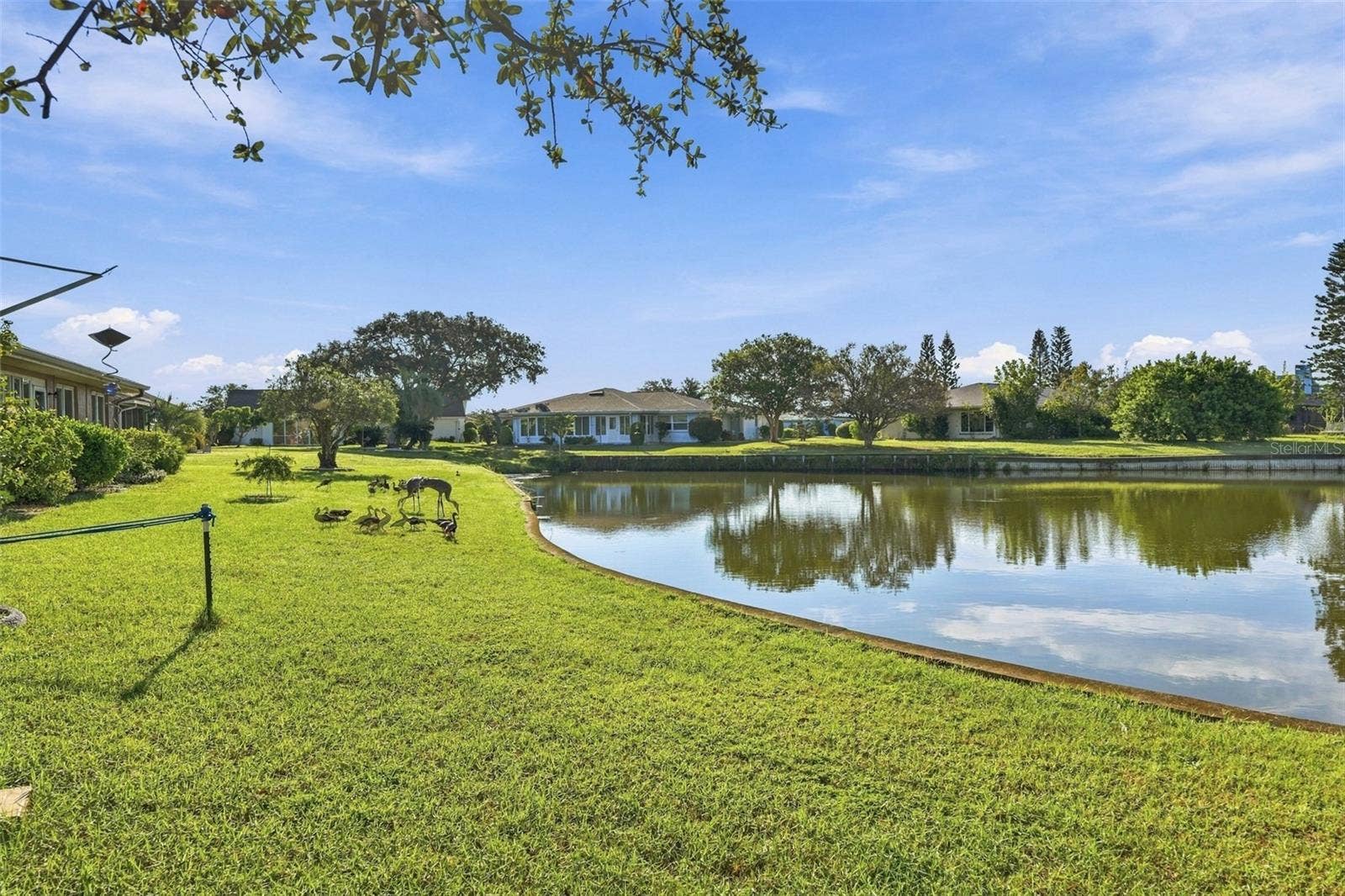 211 STONEHAM DRIVE, Sun City Center, FL 33573 Side view of the back yard.