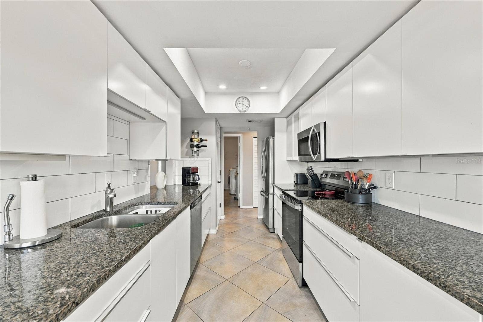 211 STONEHAM DRIVE, Sun City Center, FL 33573 From the kitchen it is easy access to the laundry room and additional storage.