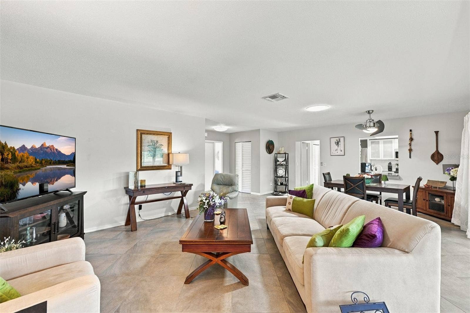 211 STONEHAM DRIVE, Sun City Center, FL 33573 Notice the soft modern neutral tones throughout the home, along with solar tubes for extra natural light and modern ceiling fans.