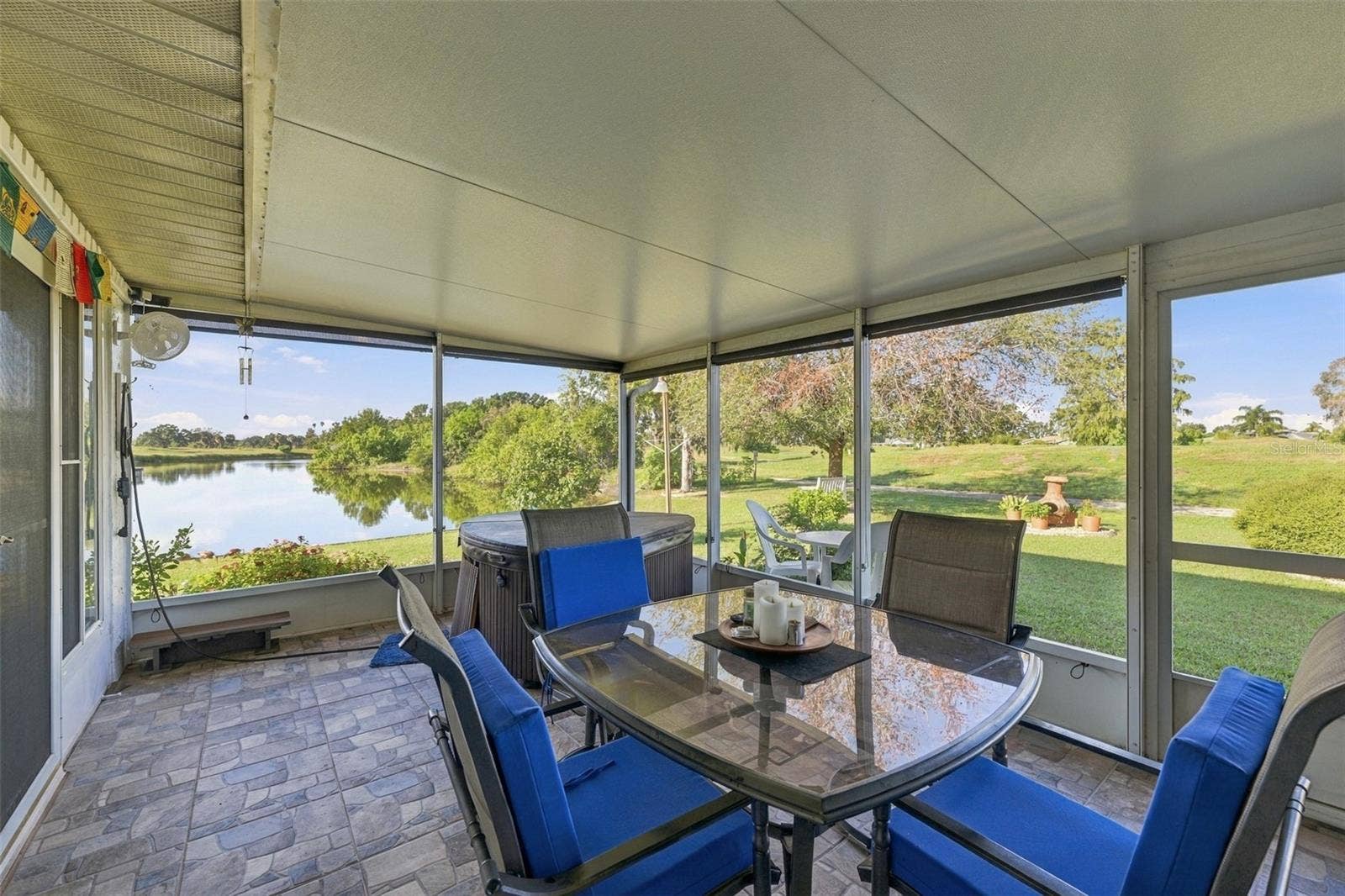 211 STONEHAM DRIVE, Sun City Center, FL 33573 Next to the Florida room is the first screened in area, which also includes a fully functioning HOT TUB, oscolating fans and a grill!