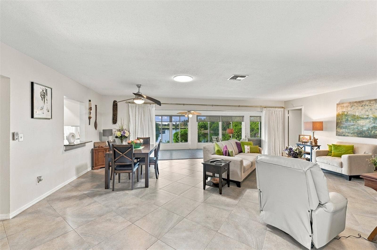 211 STONEHAM DRIVE, Sun City Center, FL 33573 As you walk into the home, nothing but water, woods and wild life are your view.