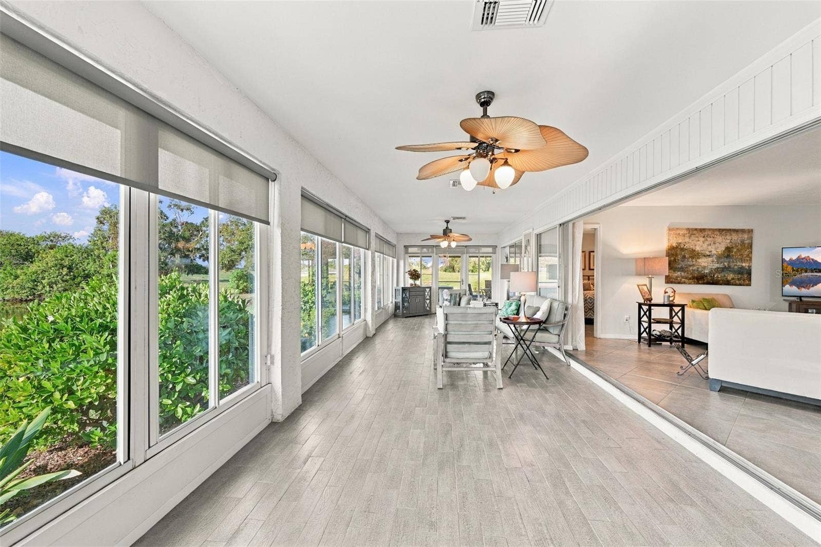 211 STONEHAM DRIVE, Sun City Center, FL 33573 The lovely tile flooring makes for easy cleaning and with multiple fans, there is always a breeze. Windows everywhere allow the outdoors to come right into your home.