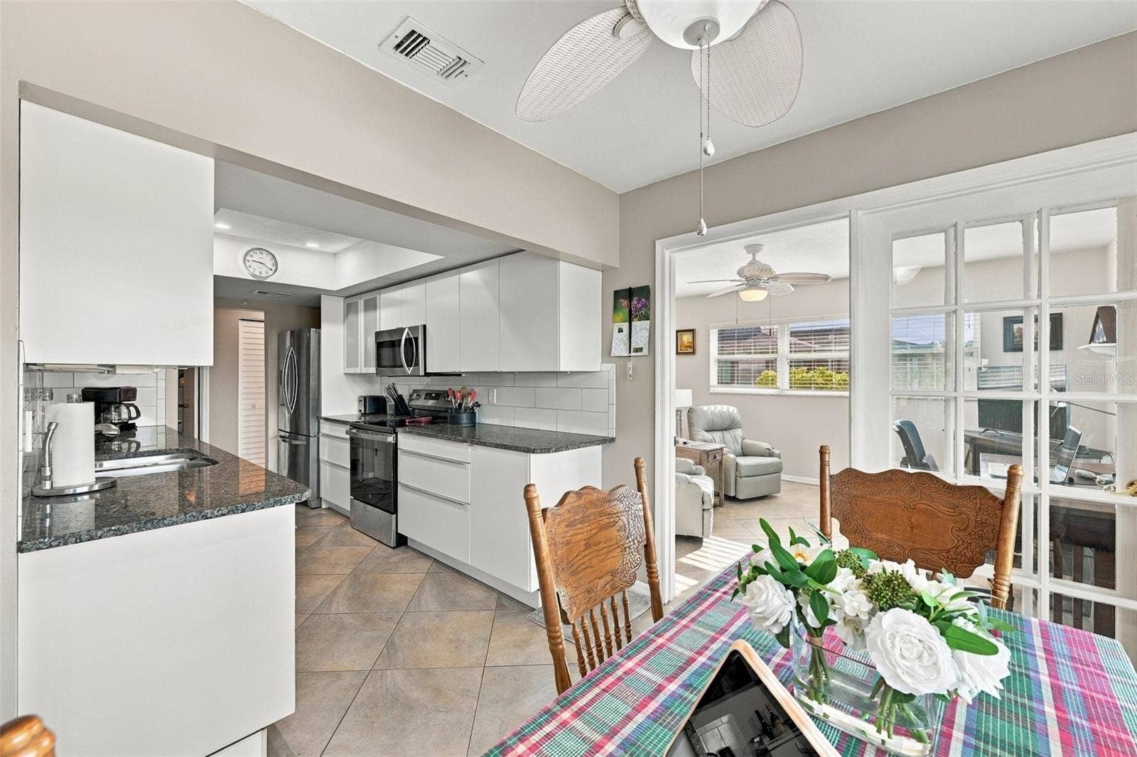 211 STONEHAM DRIVE, Sun City Center, FL 33573 Kitchen is spacious and bright, without also being the center of the home, so no one has to see any dirty dishes!
