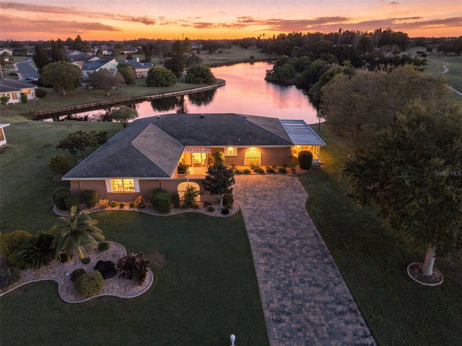 211 STONEHAM DRIVE, Sun City Center, FL 33573 This is the Florida dream on almost a 1/2 acre lot!