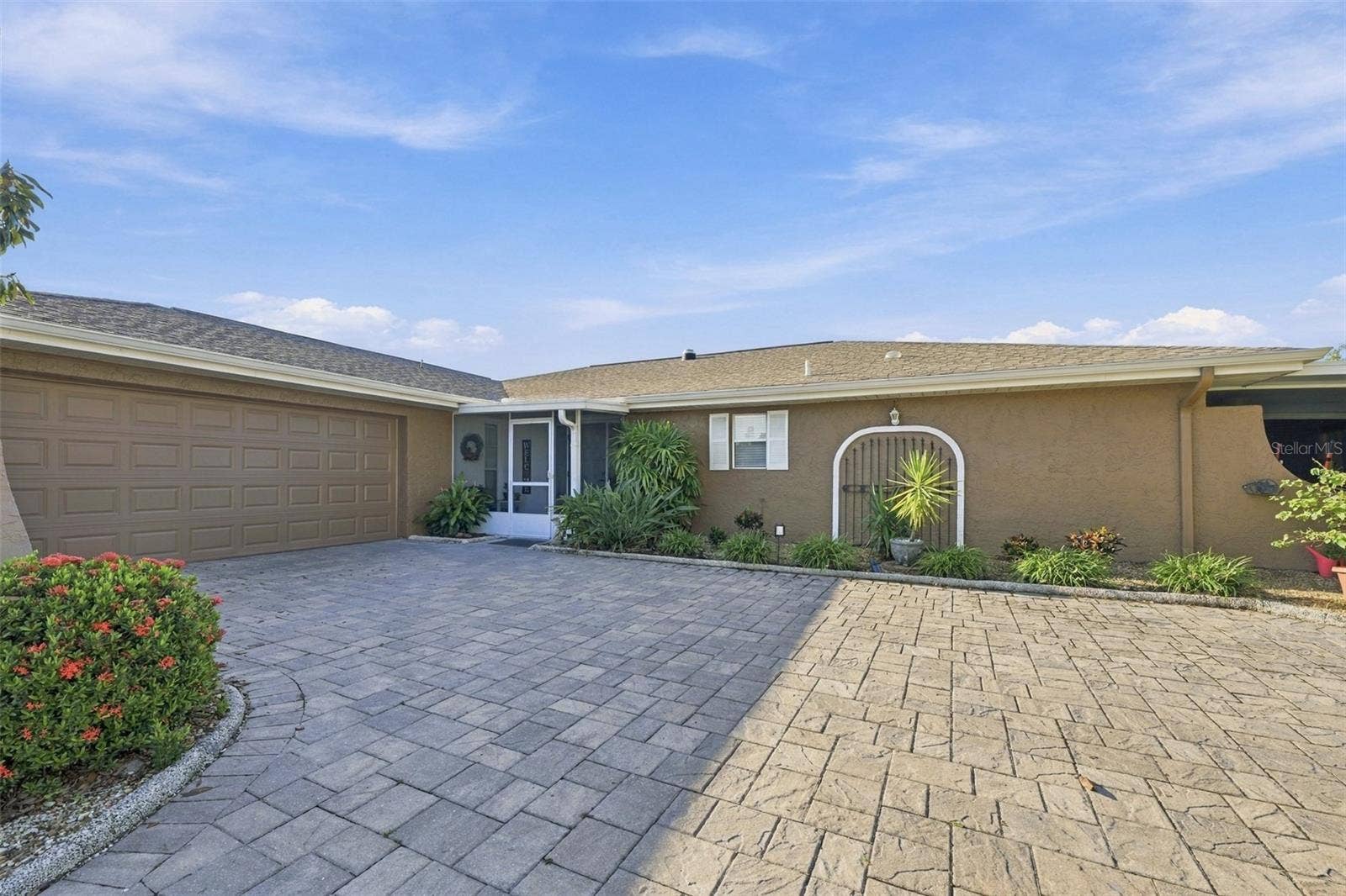 211 STONEHAM DRIVE, Sun City Center, FL 33573 Oversized parking pad is perfect for multiple family members and guests. Screened front porch is perfect for guests and packages to remain out of the weather.