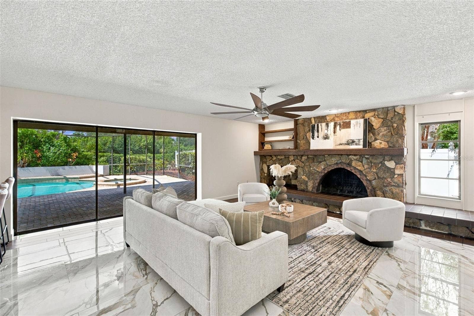 2924 TORREY PINES COURT, Clearwater, FL 33761 Living Room Sliders Fully Open to Enclosed Pool