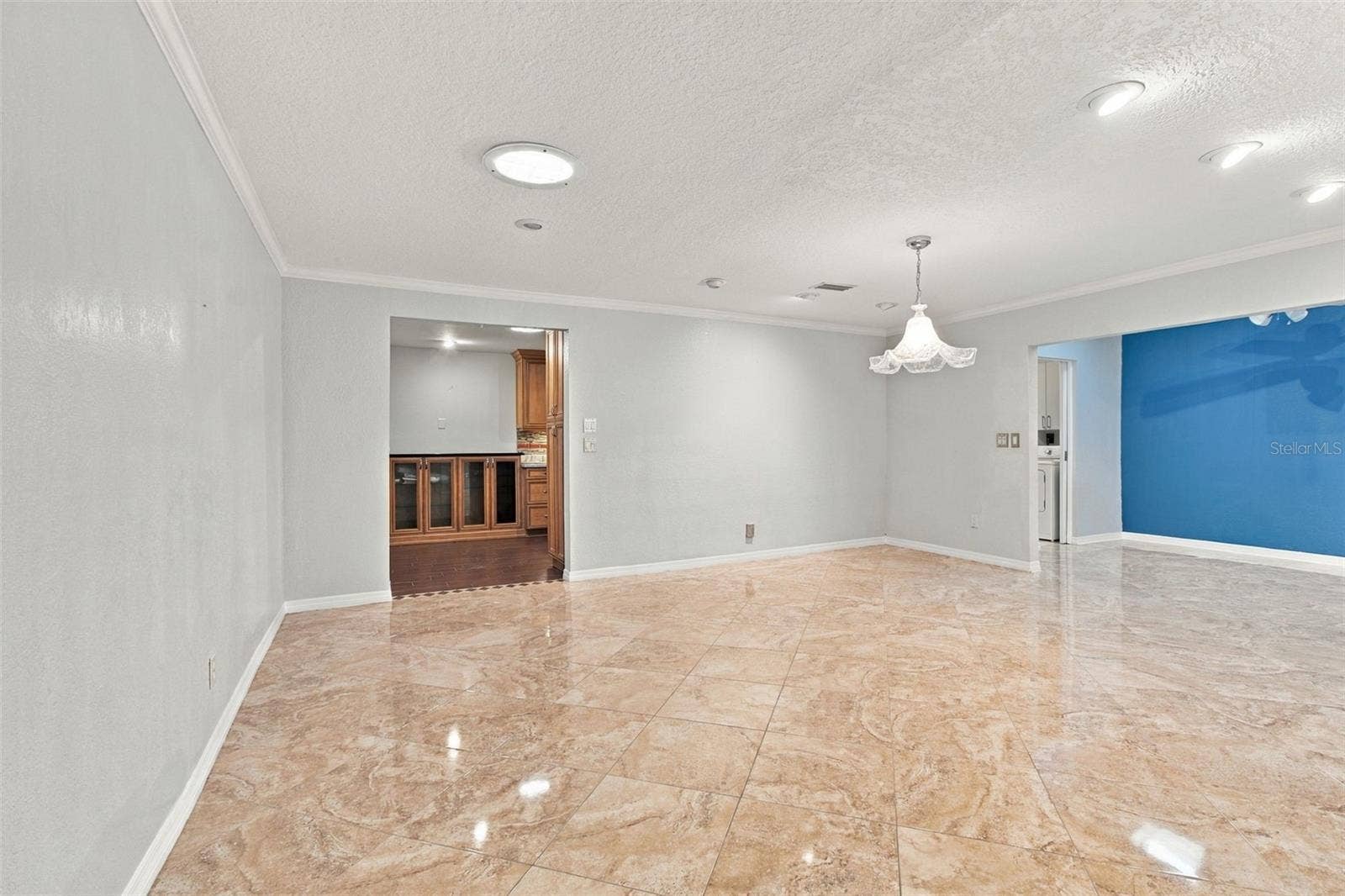 2254 HERON CIR, Clearwater, FL 33762 Wow! This dining room is huge and opens to the Sunroom with two skylights on the right and the kitchen on the left.