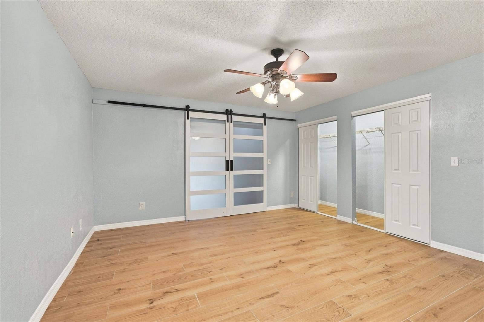 2254 HERON CIR, Clearwater, FL 33762 Second bedroom with full wall closet.