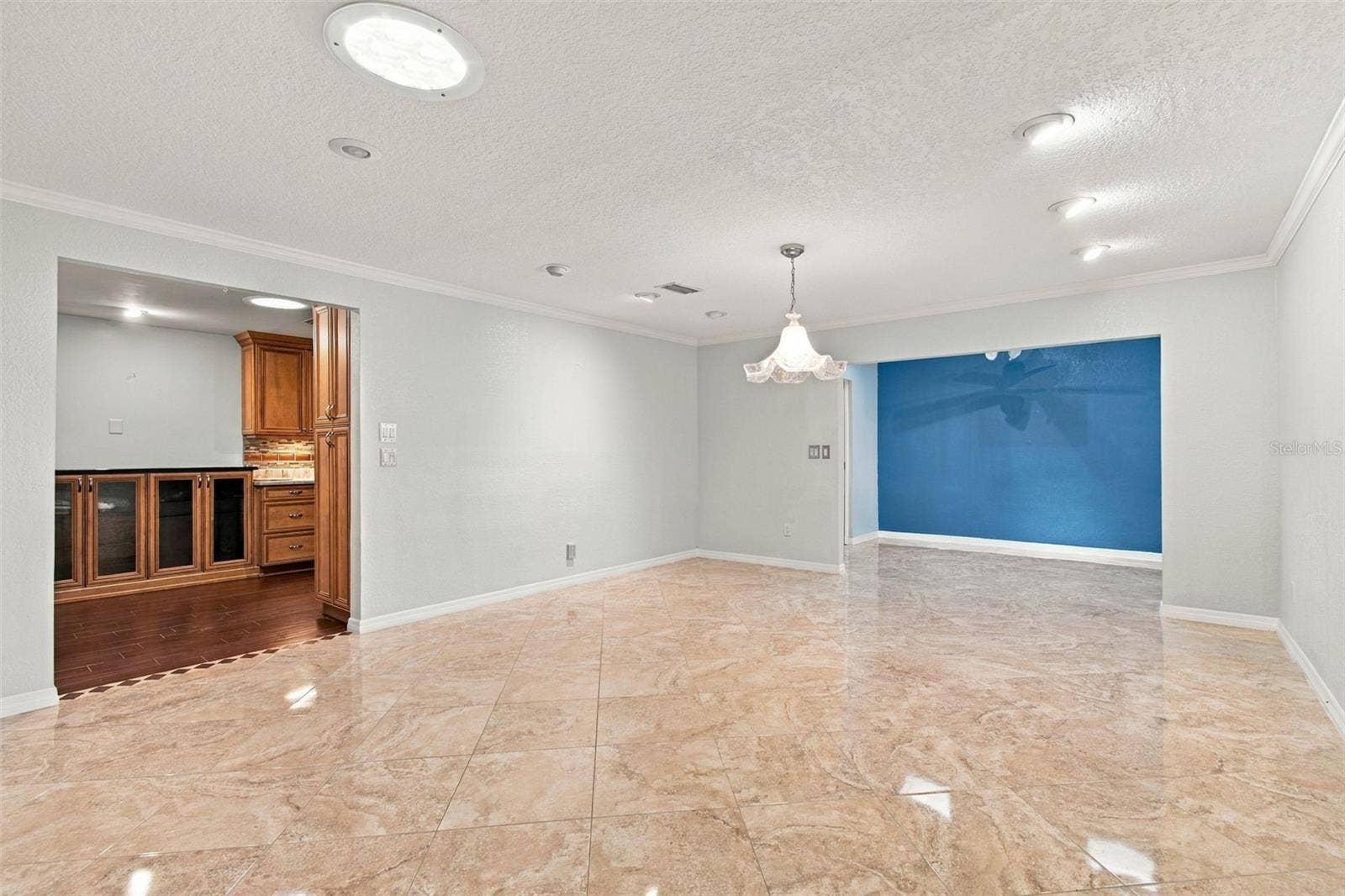 2254 HERON CIR, Clearwater, FL 33762 Wow! This dining room is huge and opens to the Sunroom on the right and the kitchen on the left.