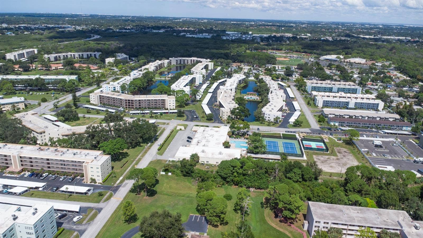 5501 80TH STREET N, #303, St Petersburg, FL 33709 Aerial of Clubhouse, Tennis/Pickleball Courts