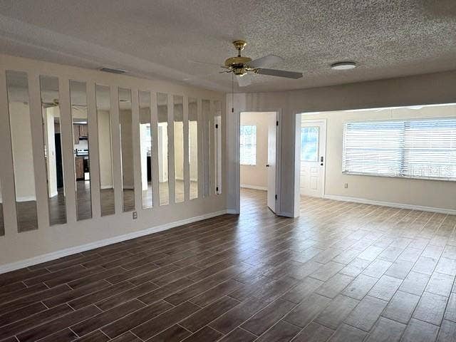 2102 HARRINGAY STREET, #449, Sun City Center, FL 33573 Living area with mirror accents to capture the natural light from the enclosed lanai.