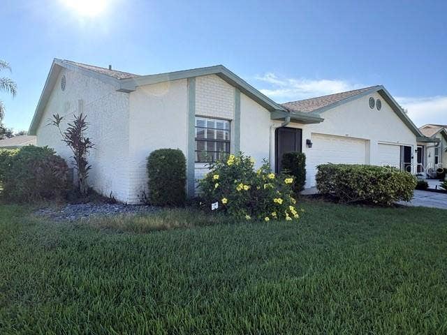 2102 HARRINGAY STREET, #449, Sun City Center, FL 33573 Lovely Florida landscaping on this corner lot.