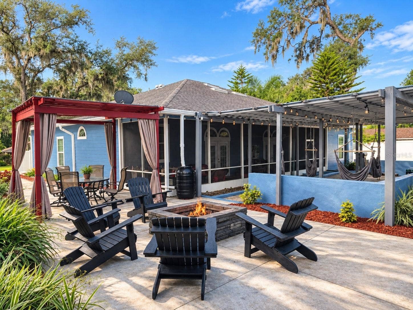 3009 W CLINTON STREET, Tampa, FL 33614 Backyard with fire pit, seating, hammocks