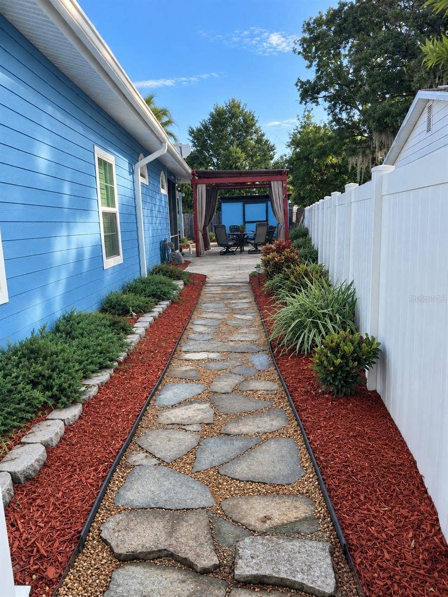 3009 W CLINTON STREET, Tampa, FL 33614 Walkway to backyard