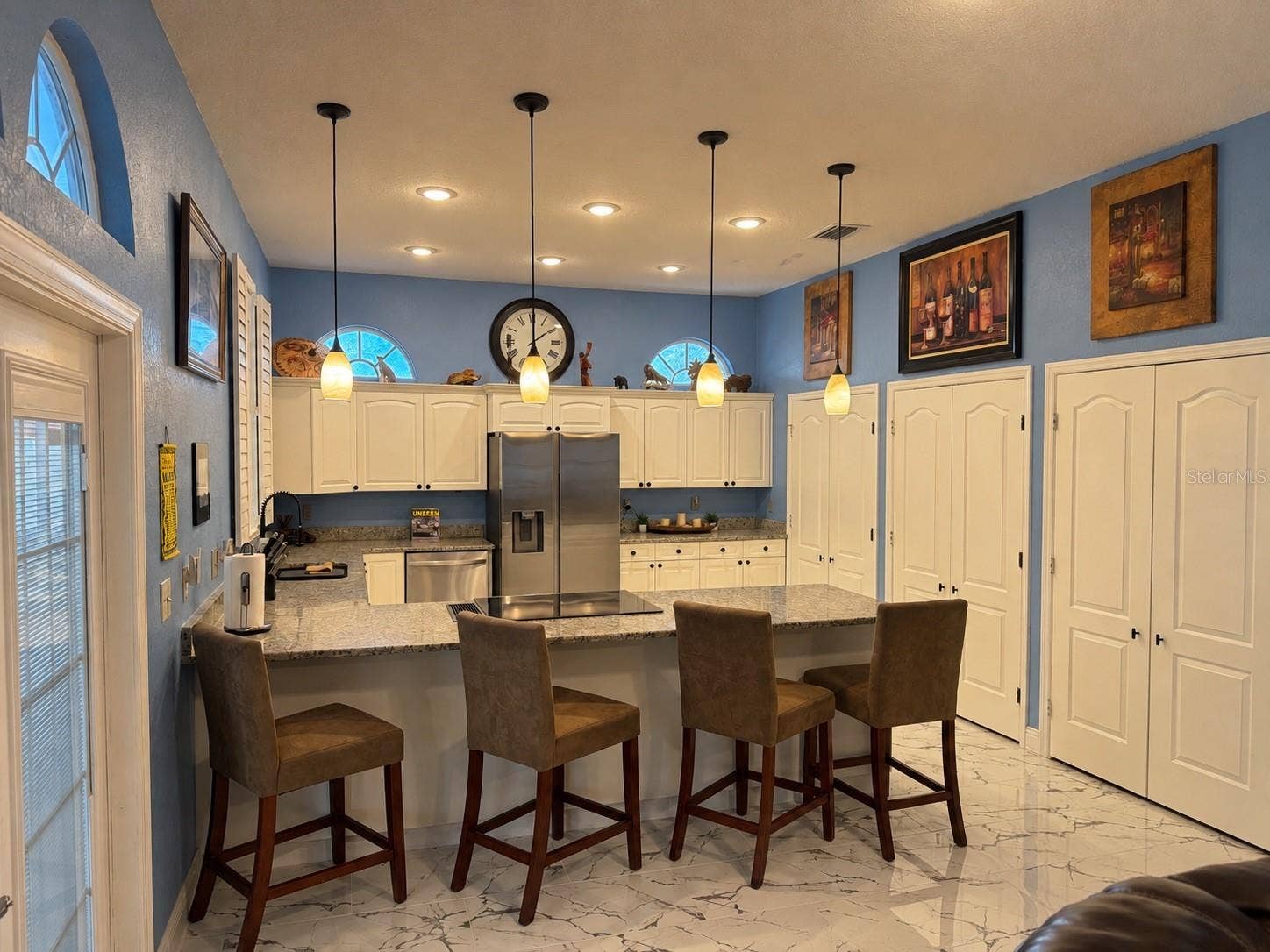 3009 W CLINTON STREET, Tampa, FL 33614 Counter eating space in kitchen. Stainless steel appliances
