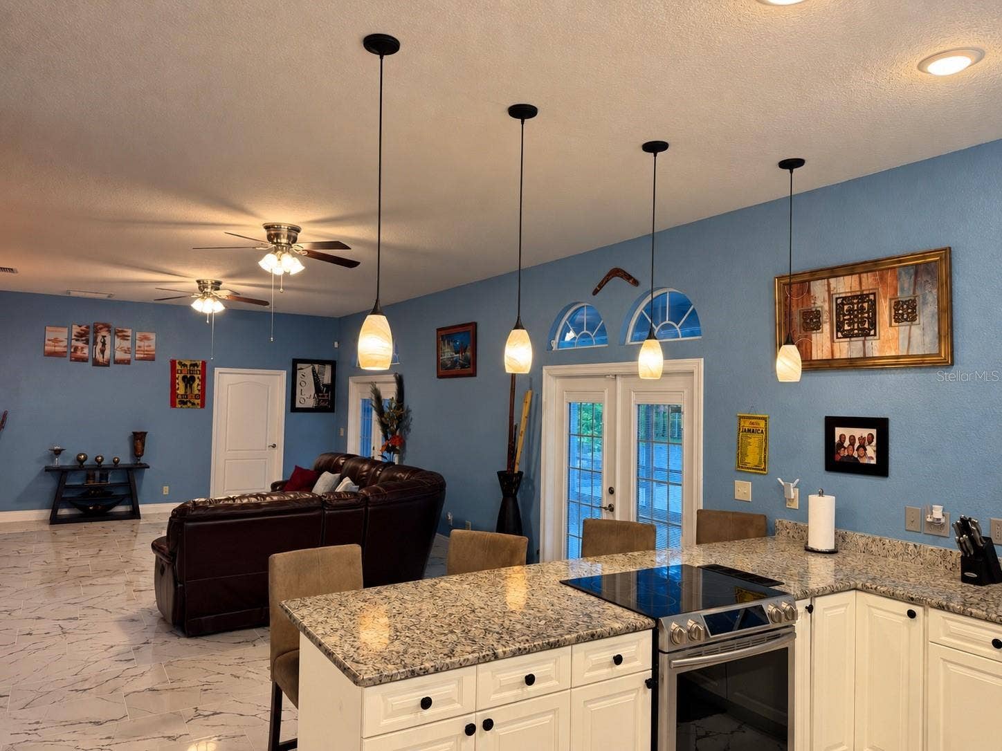 3009 W CLINTON STREET, Tampa, FL 33614 White cabinets and view to living room. Great for entertaining!