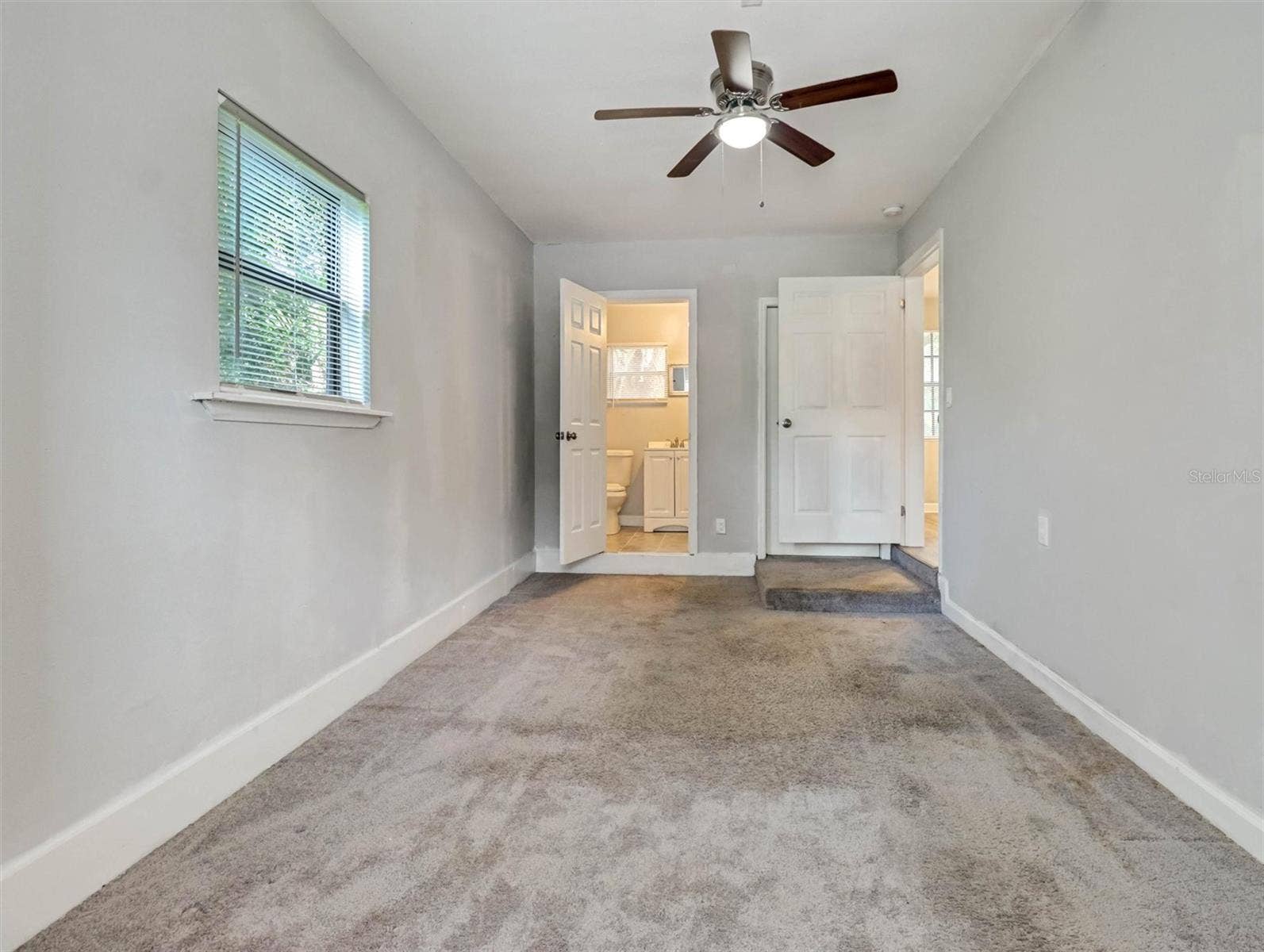 Primary Bedroom 2 with Half Bath and Backyard Acces