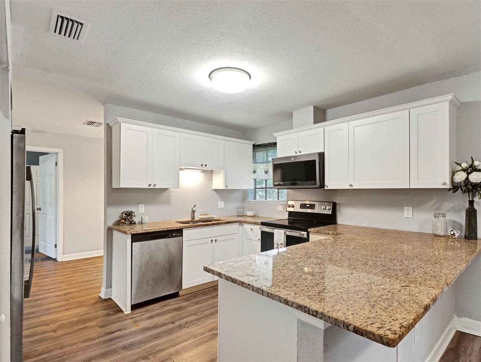 Granite Countertops, Stainless Steel Appliances and Lots of Cabinet Storage