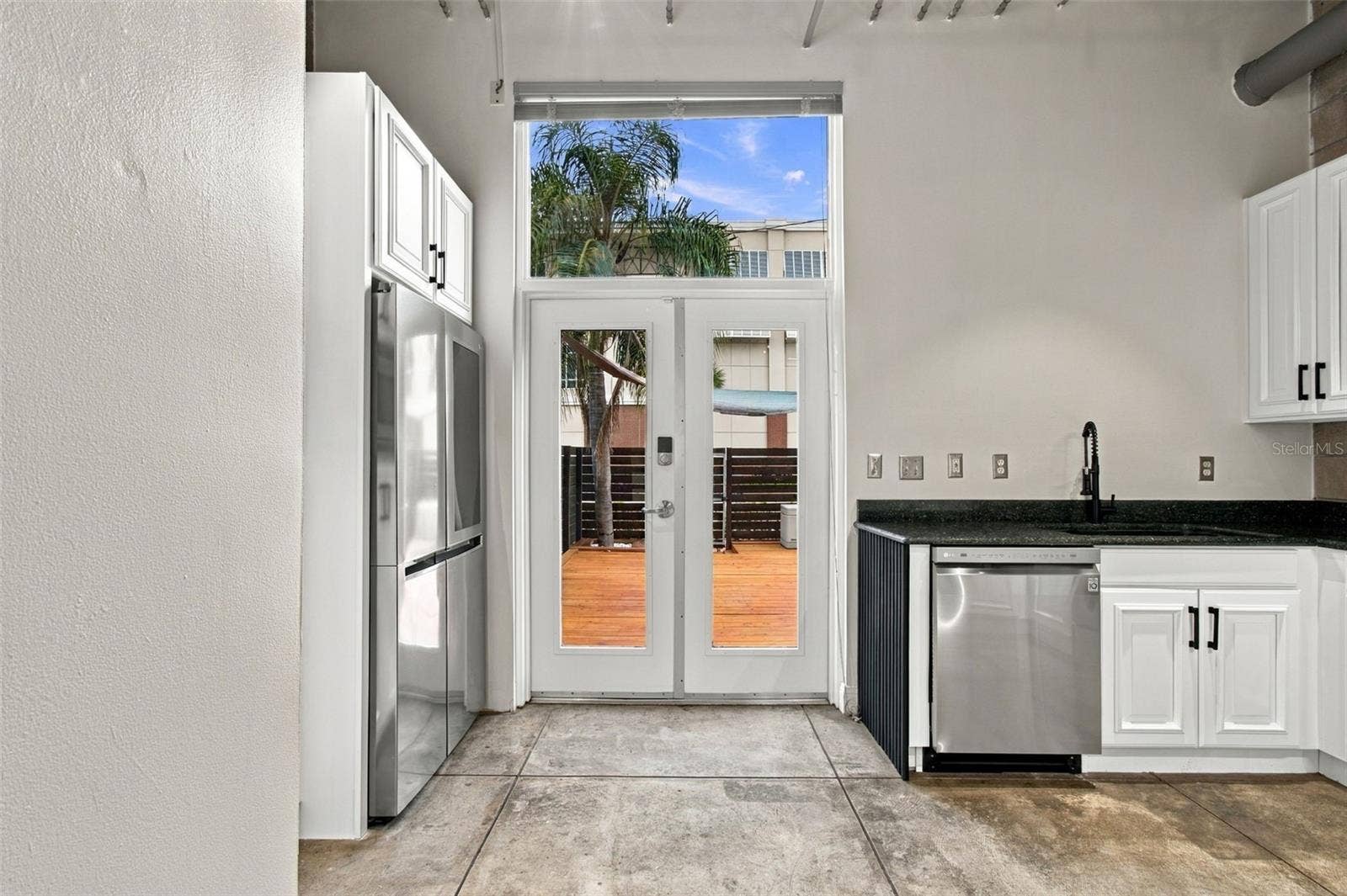 2509 W AZEELE STREET, Tampa, FL 33609 Stainless steel appliances with freshly painted cabinets and new hardware.