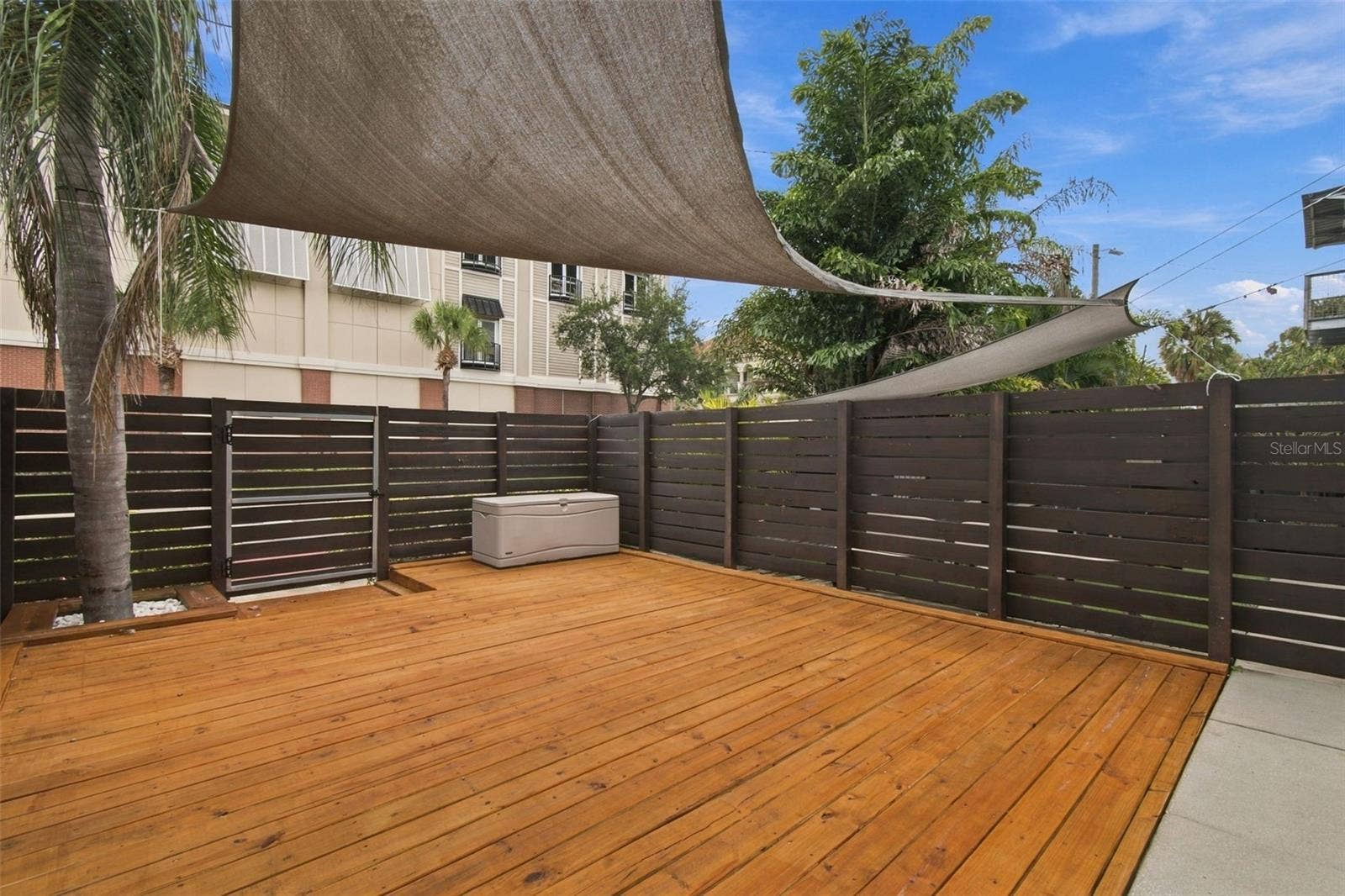 2509 W AZEELE STREET, Tampa, FL 33609 Inviting outdoor wood deck, perfect for relaxing or entertaining.
