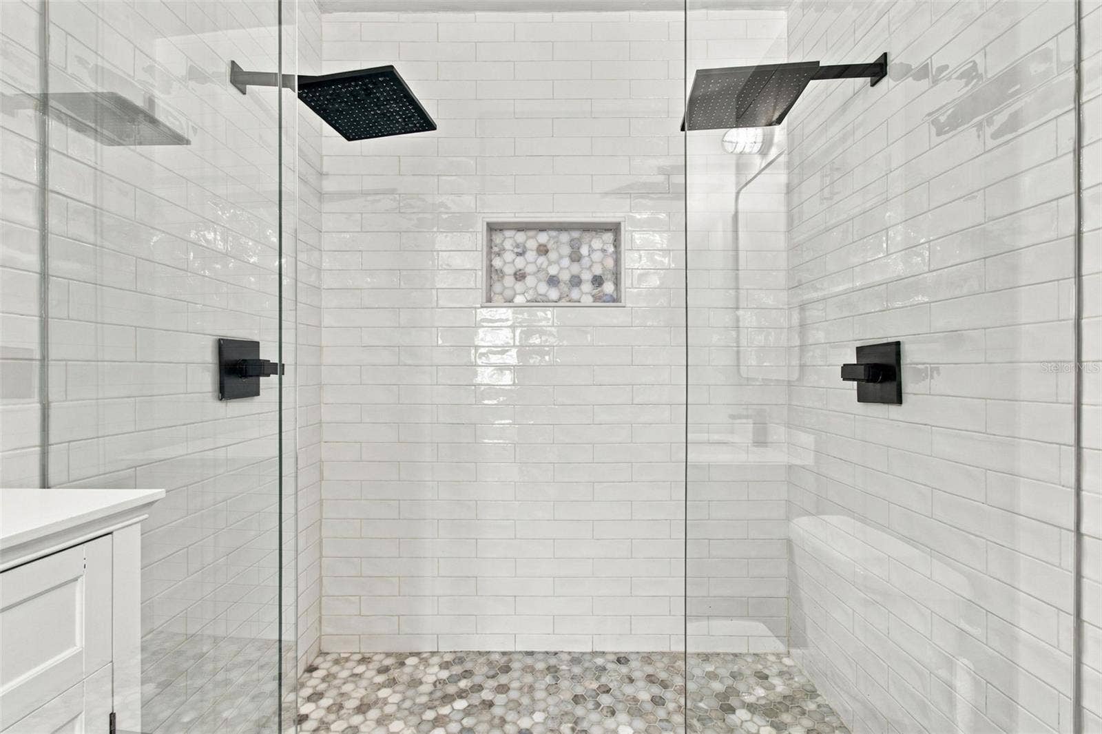 2509 W AZEELE STREET, Tampa, FL 33609 Dual rain-style shower heads featured in primary bathroom.