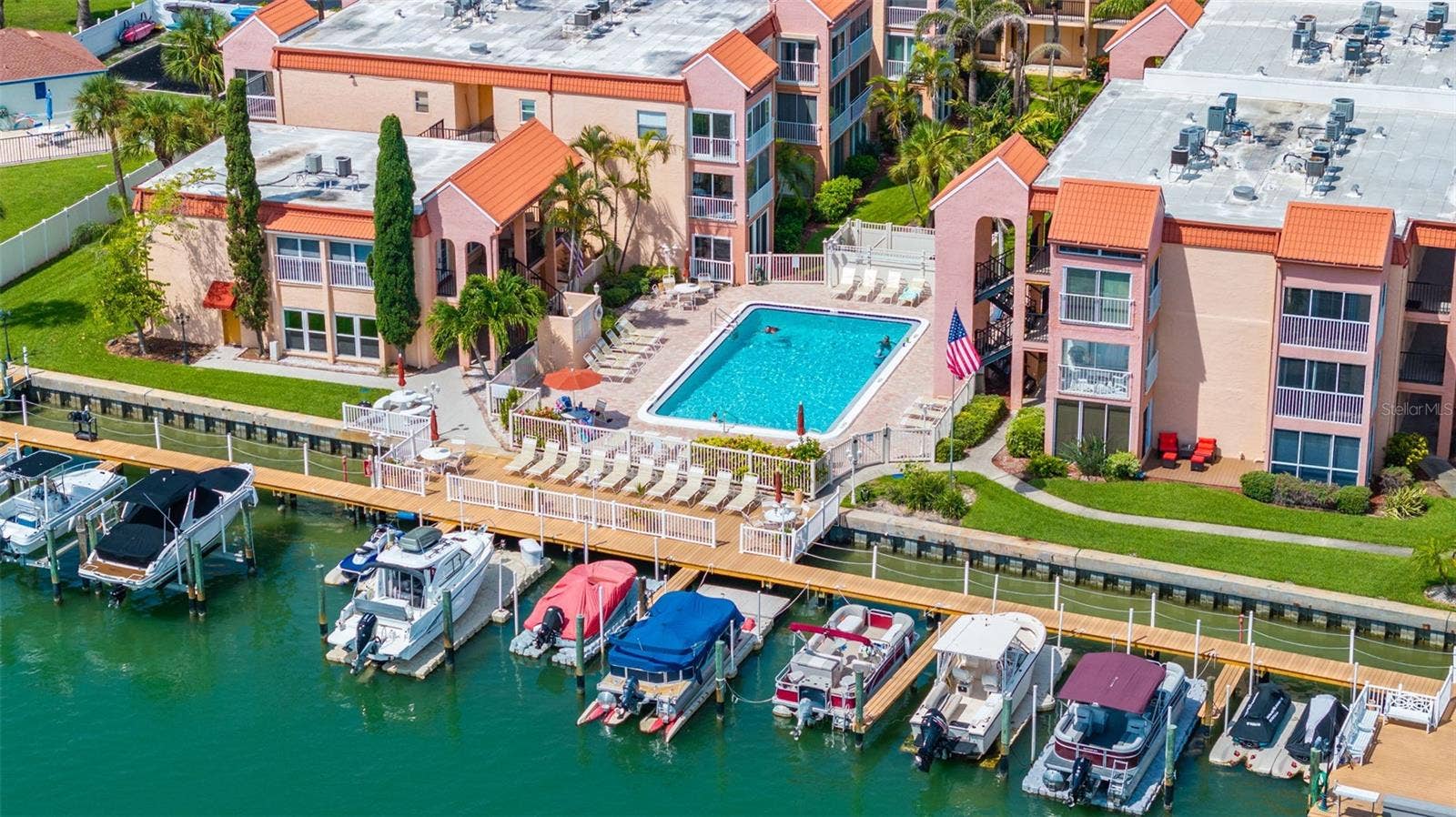 8921 BLIND PASS ROAD, #250, St Pete Beach, FL 33706 aerial view of deck and pool